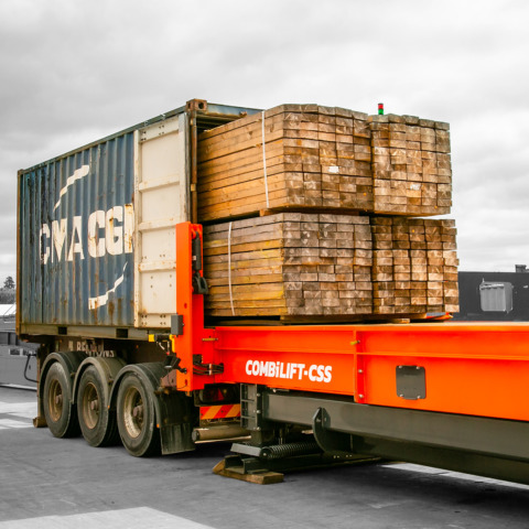 Container slip sheet wood handling